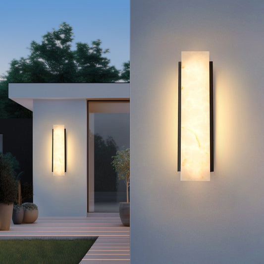 Modern outdoor wall lights on a house exterior with a night scene.